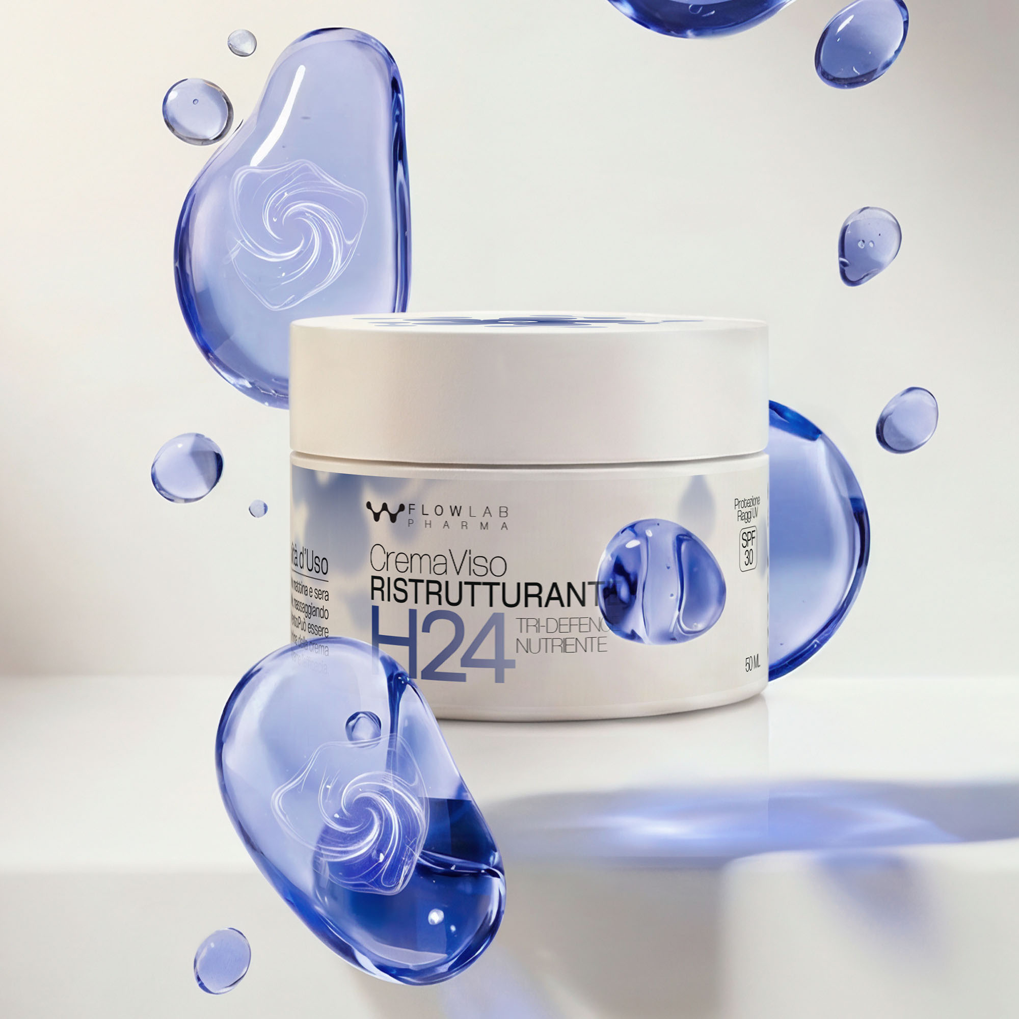Packshot della crema viso RISTRUTTURANTE H24 con bolle blu